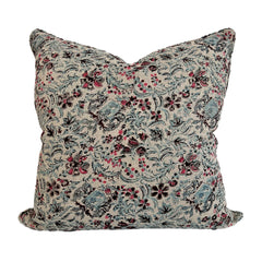 Photo of linen cushion showing up close pattern of blue and pink floral on beige linen