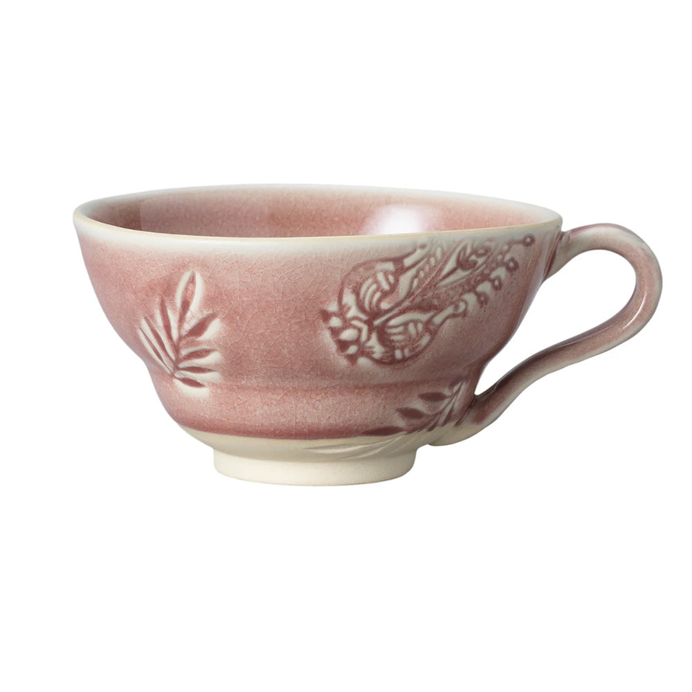 Close up side view photo of a ceramic coffee cup in a an old rose glossy glaze finish.