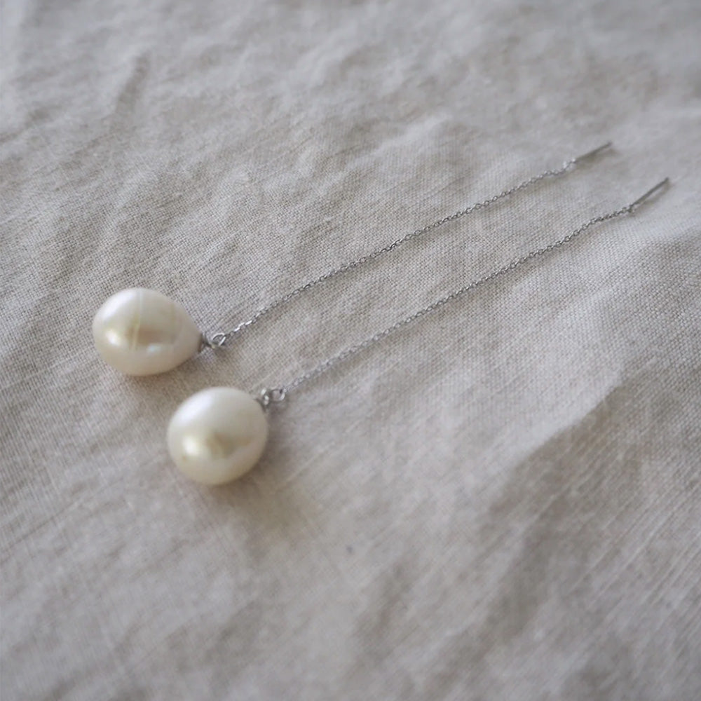 Photo of a sterling silver chain earring thread with a freshwater pearl at the end. 