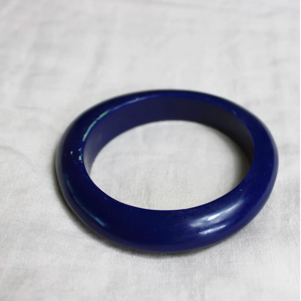 Photo of a dark navy blue resin bracelet.