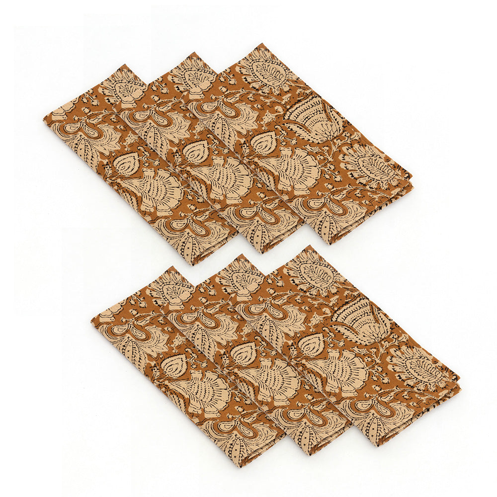 Photo of 6 folded cream and spice brown cotton napkins.