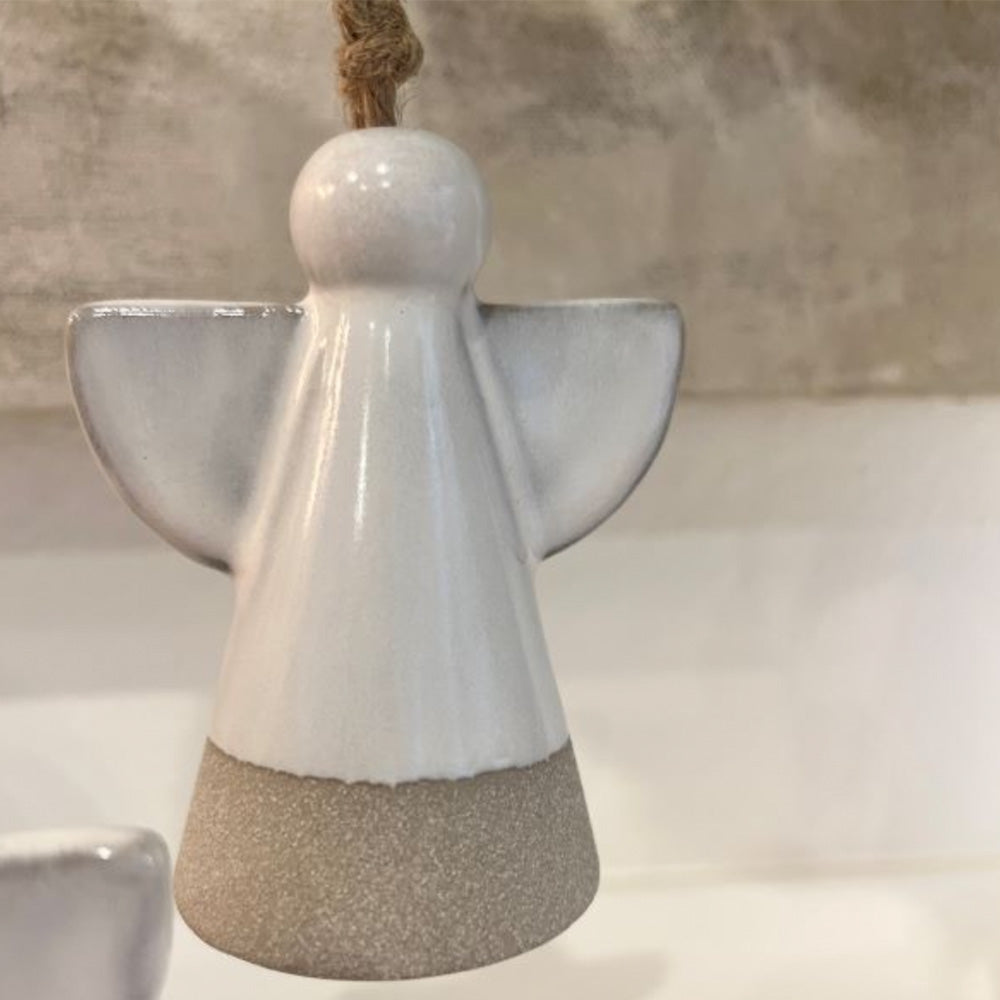 Photo of white ceramic angel hanging ornament.