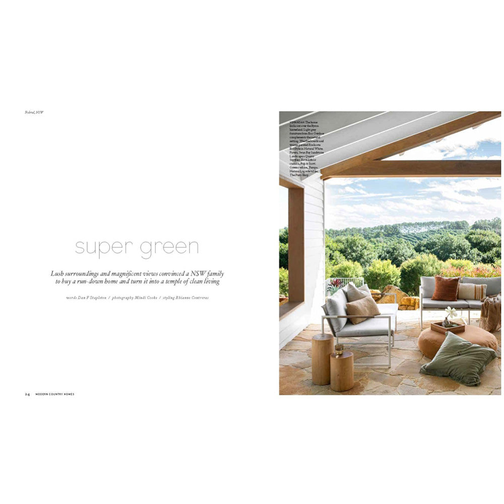 Photo of the inside page of Modern Country Homes book with a photo of an outdoor seating area.