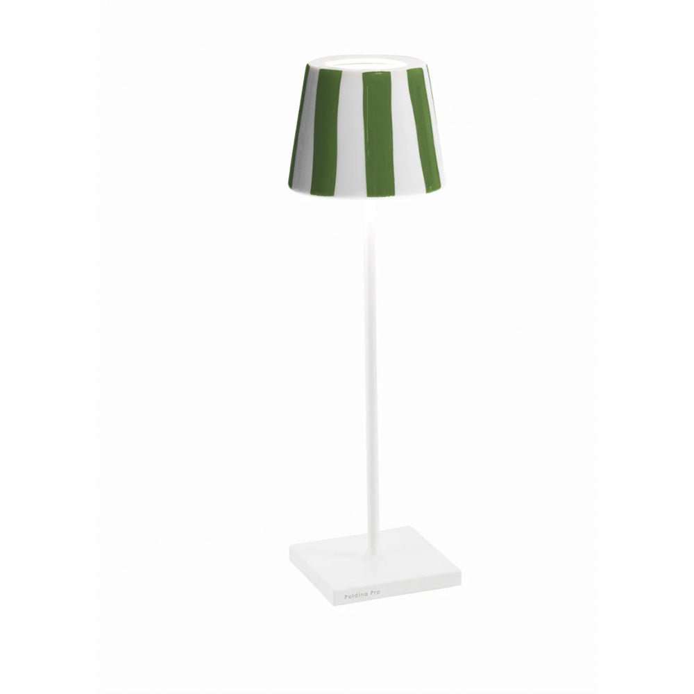 Photo of a white metal battery operated table lamp showing the ceramic lamp shade cover in a glossy green and white stripe glaze.