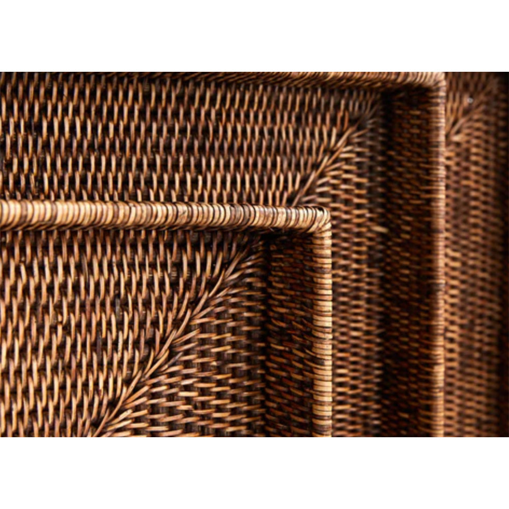 Close up photo of three dark rattan trays sitting in one another to show rattan and edge details.