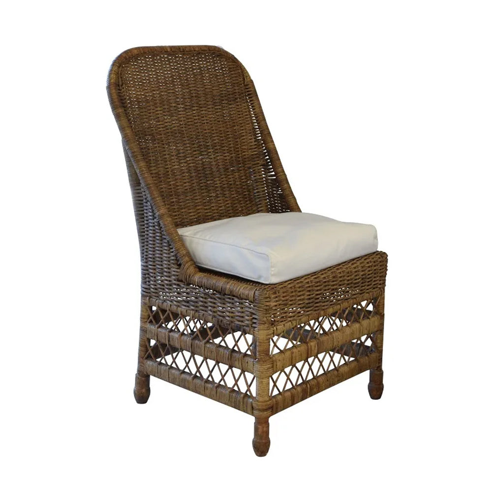 Photo of dark antique finish rattan dining chair with cream seat cushion