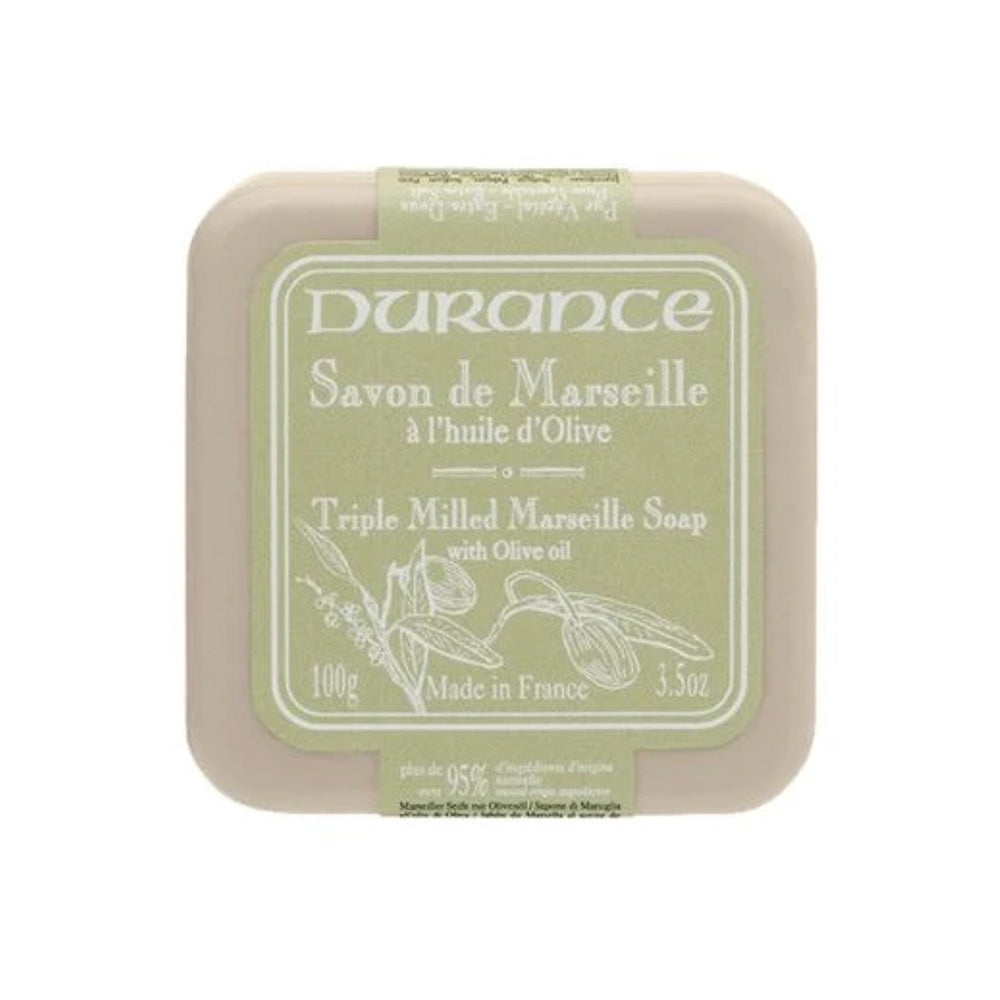 Olive green square soap bar with green and white label explaining product