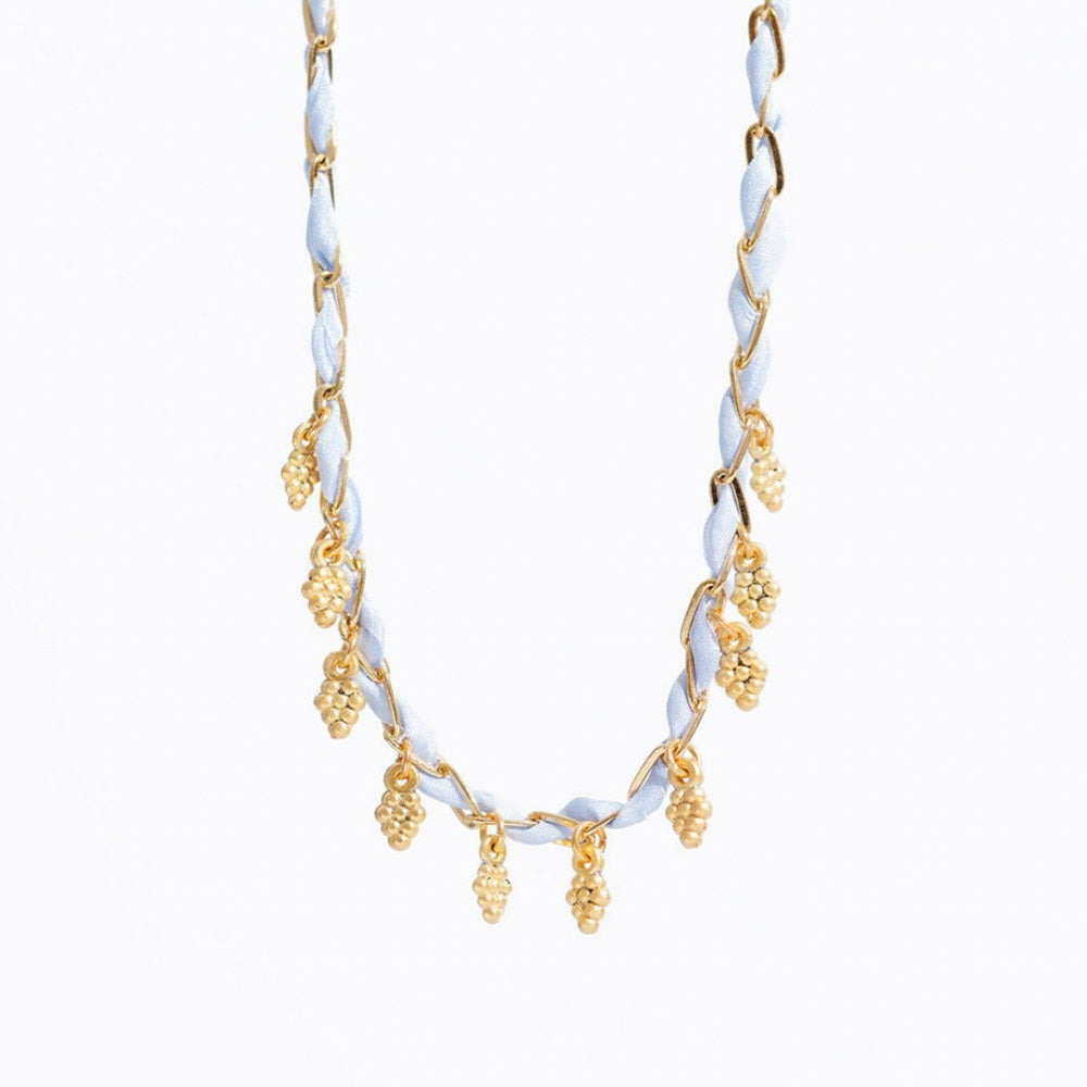 Photo of gold plated and blue silk necklace interwoven with small gold grape charms