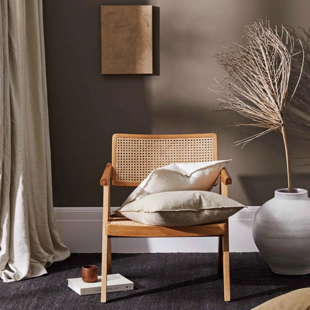 Photo of white boucle cushion and coffee coloured boucle cushion on timber chair