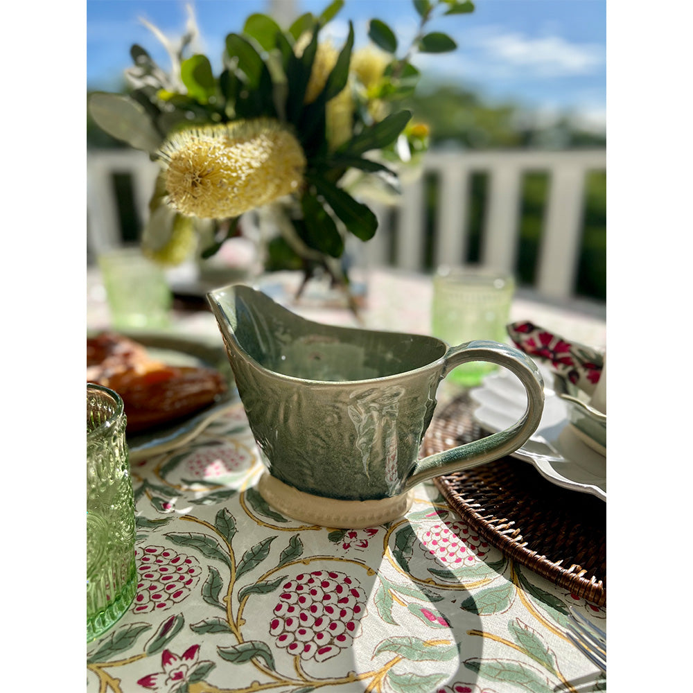 Photo of pink and green pomegranate Ava cotton tablecloth