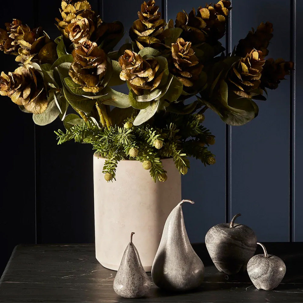 Photo of black marble apples and pears in different sizes with metal stalks